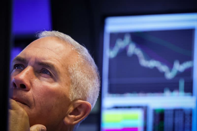 Traders work on the floor of the NYSE in New York