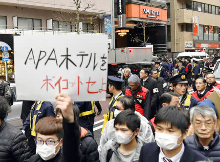 Chinese residents in Japan march at a protest against the Japanese hotel chain APA in Tokyo, Japan in this photo taken by Kyodo February 5, 2017. Mandatory credit Kyodo/via REUTERS