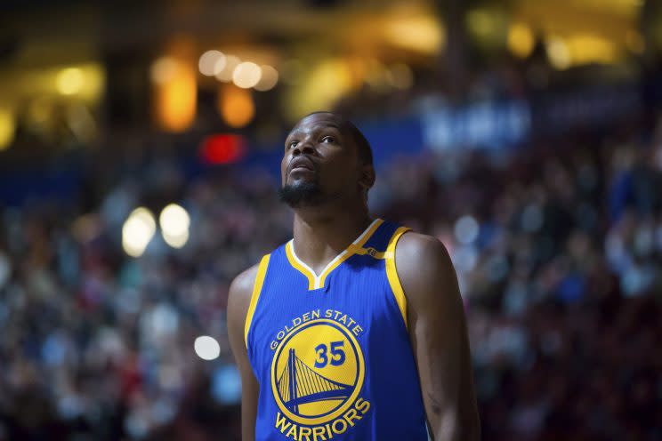 Seeing Kevin Durant in a Warriors uniform may take a moment to get used to. (AP)