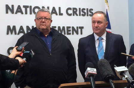 New Zealand Prime Minister John Key (R) stands with acting minister for civil defence Gerry Brownlee as they listen to a question from a journalist during a media conference in Wellington, New Zealand, November 14, 2016. REUTERS/Charlotte Greenfield