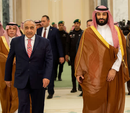 Saudi Arabia's Crown Prince Mohammed bin Salman walks with Iraq's Prime Minister Adel Abdul Mahdi in Riyadh, Saudi Arabia April 17, 2019. Picture taken April 17, 2019. Bandar Algaloud/Courtesy of Saudi Royal Court/Handout via REUTERS