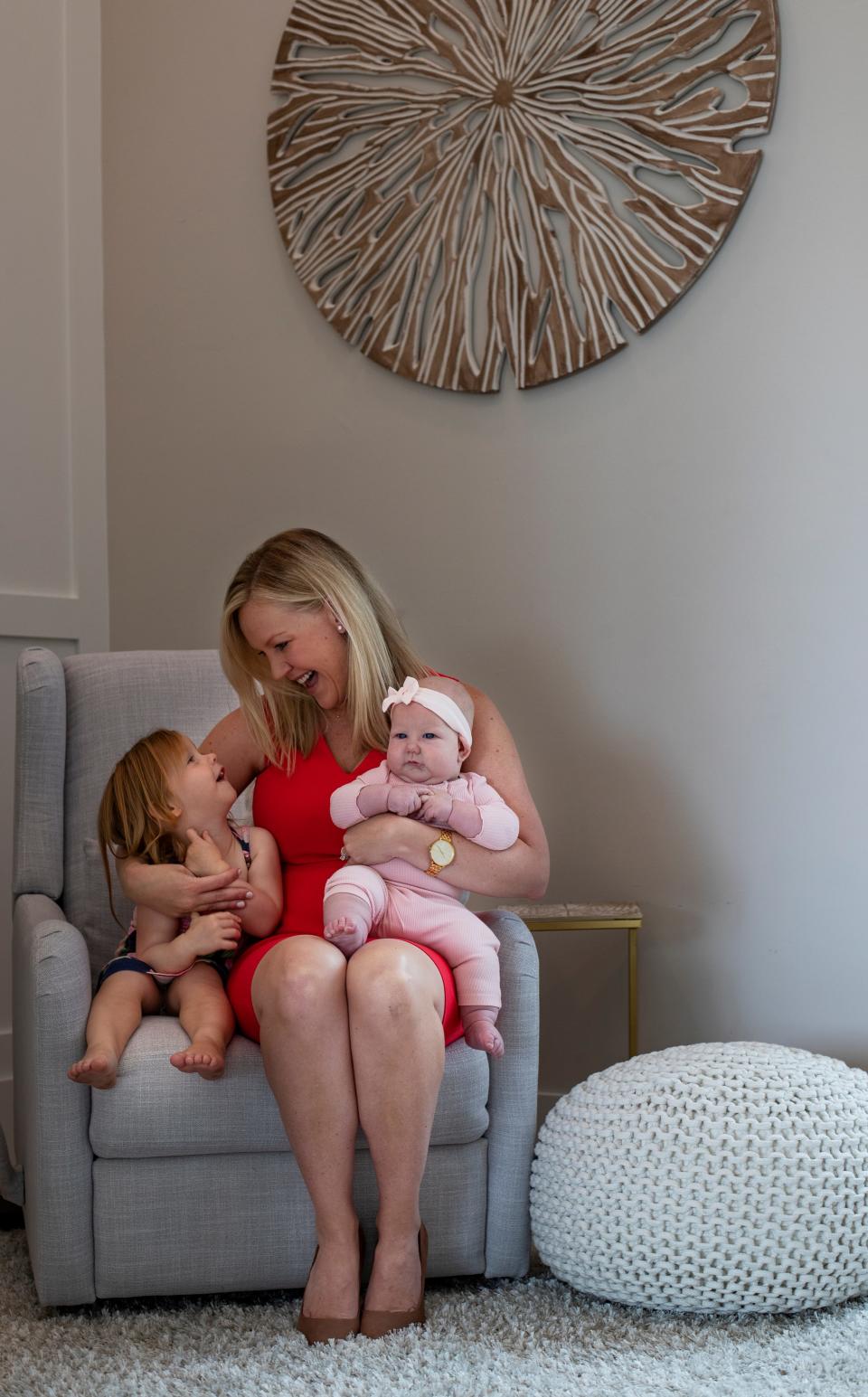 Megan Rose, founder and CEO of the nonprofit Better Together, poses for a portrait with her two daughters Emma and Ava.