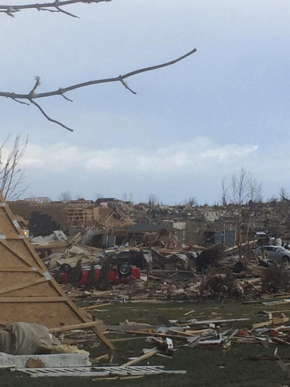 Extensive damage to homes and vehicles is pictured in the aftermath of a tornado that touched down in Washington, Illinois November 17, 2013, in this photo courtesy of Anthony Khoury. A fast-moving storm system spawned multiple tornadoes in Illinois and Indiana, threatening some 53 million people across 10 Midwestern states on Sunday, U.S. weather officials said. Washington, Illinois is located 145 miles (233 km) southwest of Chicago. REUTERS/Anthony Khoury/Handout via Reuters (UNITED STATES - Tags: DISASTER ENVIRONMENT) ATTENTION EDITORS - THIS IMAGE HAS BEEN SUPPLIED BY A THIRD PARTY. IT IS DISTRIBUTED, EXACTLY AS RECEIVED BY REUTERS, AS A SERVICE TO CLIENTS. NO SALES. NO ARCHIVES. FOR EDITORIAL USE ONLY. NOT FOR SALE FOR MARKETING OR ADVERTISING CAMPAIGNS. MANDATORY CREDIT