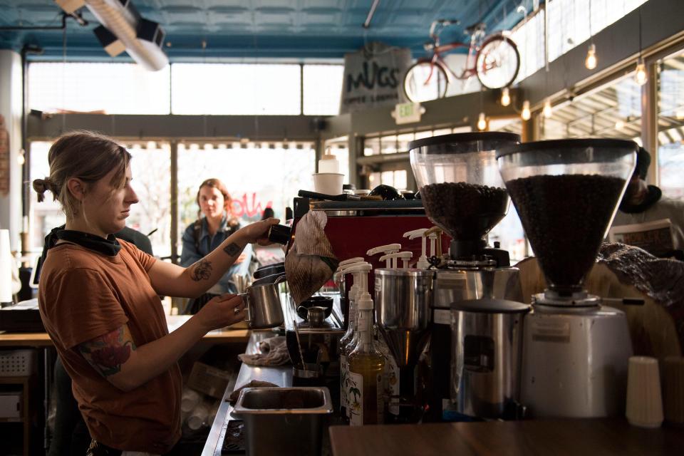 In this file photo, barista Megan Carr prepares a customer's vanilla latte on Jan. 28, 2019, at Mugs in Old Town Fort Collins.