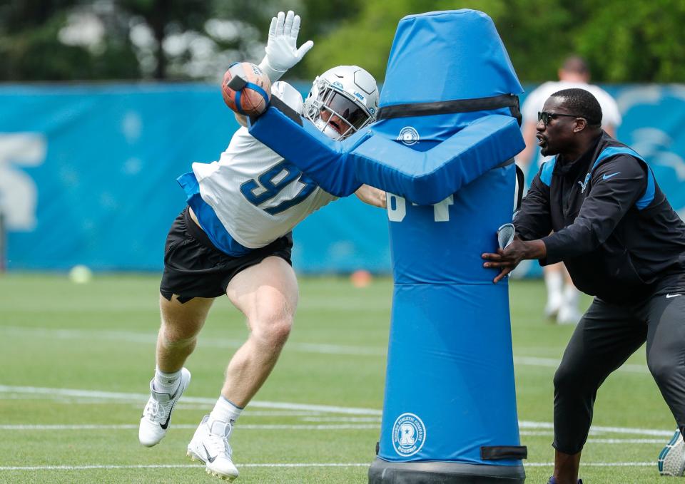 Detroit Lions defensive end Aidan Hutchinson (97) practices during minicamp at Detroit Lions Headquarters and Training Facility in Allen Park on Tuesday, June 6, 2023.