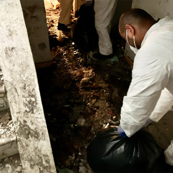 Image: Cleanup crews clean sewage, dirt and damage from the basement of Johnson Ho's apartment. (Courtesy Johnson Ho)