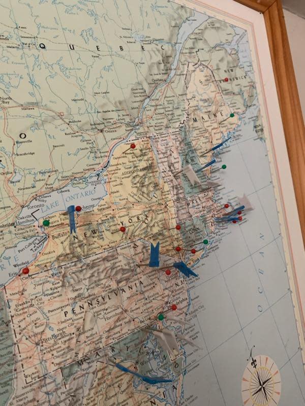 Dana Almeida has a map of the United States hanging in his basement to track where he has played golf.