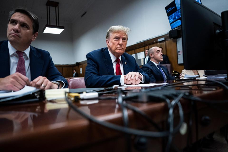 Former President Donald Trump sits in the courtroom during the first day of his trial for allegedly covering up hush money payments linked to extramarital affairs, at Manhattan Criminal Court in New York City on April 15, 2024.