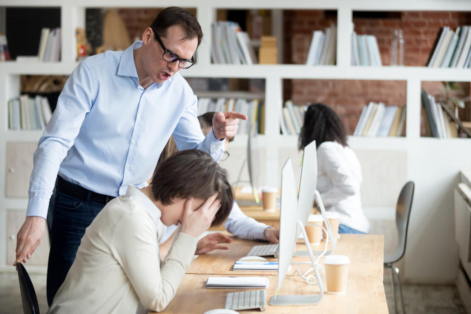 Furious businessman shout at female employee working in shared office, mad male boss scream at guilty intern, blaming for mistake, CEO accuse woman worker in company failure or bad results