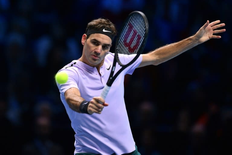 Switzerland's Roger Federer returns to Croatia's Marin Cilic during their men's singles round-robin match on day five of the ATP World Tour Finals, at the O2 Arena in London, on November 16, 2017