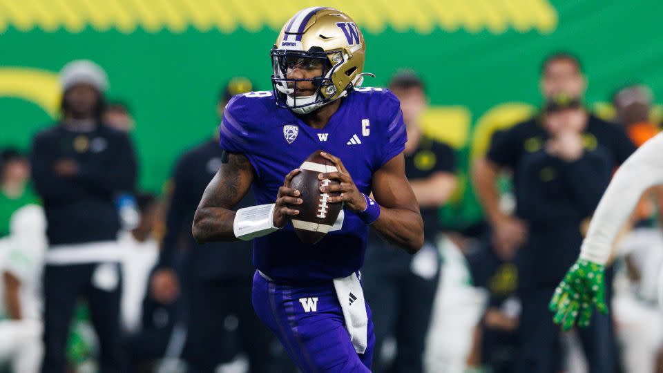 Penix Jr. rolls out to pass during the Pac-12 Championship game against Oregon. - Ric Tapia/AP