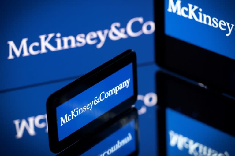 Screens displaying the logo of US-based McKinsey & Company, the world's top management consulting firm (Lionel BONAVENTURE)