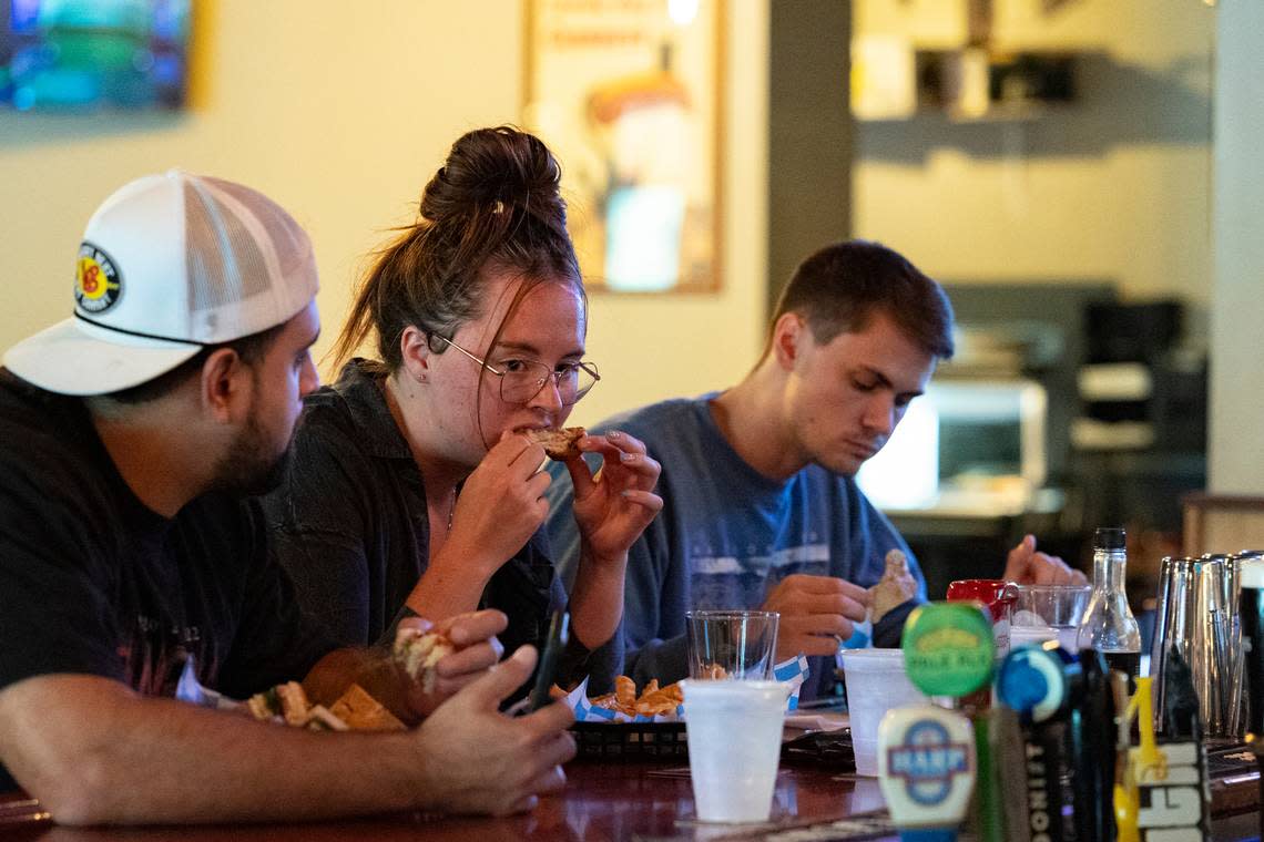 Mario Villegas, Madison Burlett and Austin Shealy dine at Publick House.