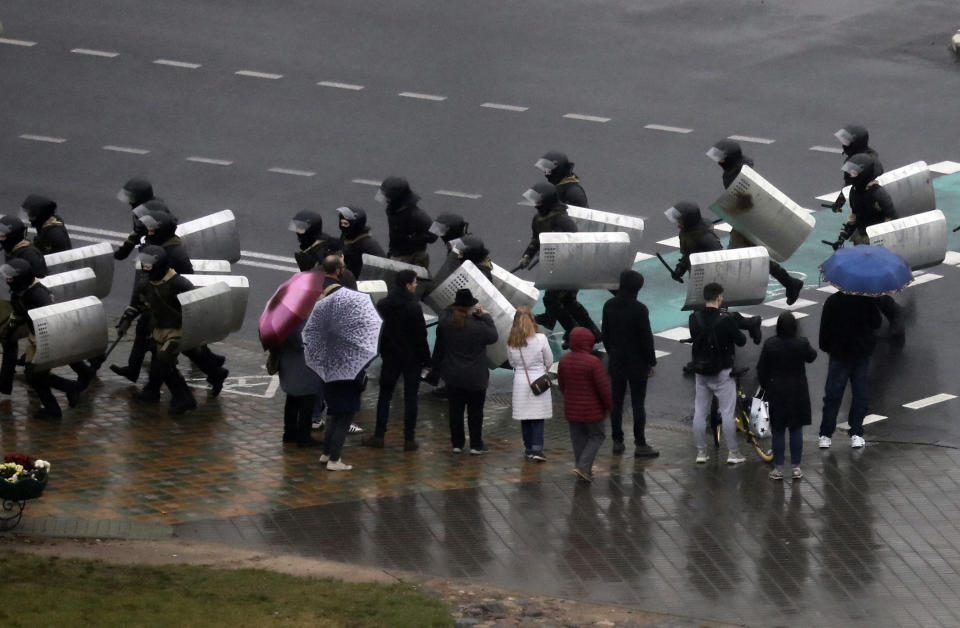 Belarusian police block a street during an opposition rally to protest the official presidential election results in Minsk, Belarus, Sunday, Oct. 11, 2020. Belarus' authoritarian president Alexander Lukashenko on Saturday visited a prison to talk to opposition activists, who have been jailed for challenging his re-election that was widely seen as manipulated and triggered two months of protests. (AP Photo)