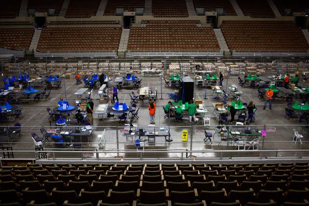 Contractors working for Cyber Ninjas examine and recount ballots from the 2020 general election on May 3, 2021, in Phoenix, Arizona. (Photo: The Washington Post via Getty Images)