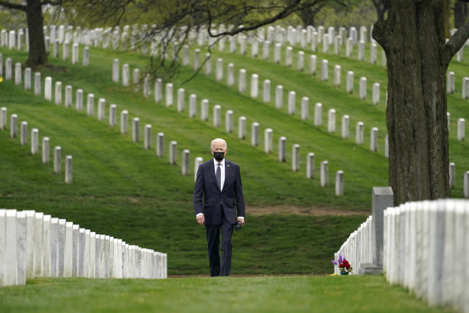 FILE - In this April 14, 2021, file photo President Joe Biden visits Section 60 of Arlington National Cemetery in Arlington, Va. The need for crisis-driven leadership comes to all U.S. presidents. Now, on several fronts at once, it has come to President Joe Biden. As the president who is ending America's longest war, in Afghanistan, he will be judged by history for how he did it. (AP Photo/Andrew Harnik, File)