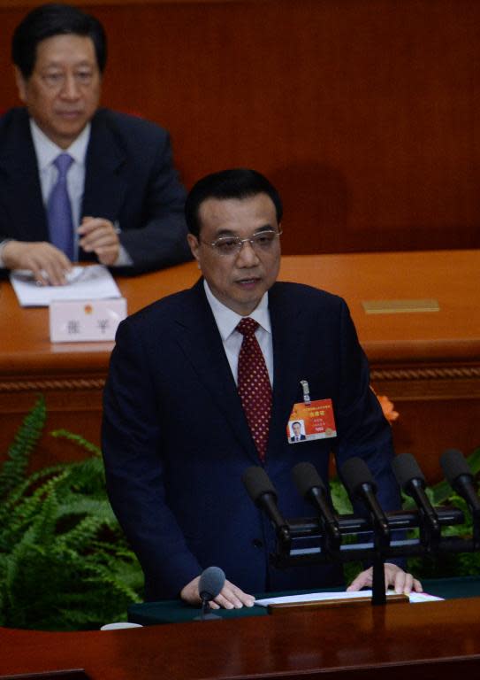 Chinese premier Li Keqiang delivers his work report during the opening of the third session of the 12th National People's Congress at the Great Hall of the People in Beijing on March 5, 2015