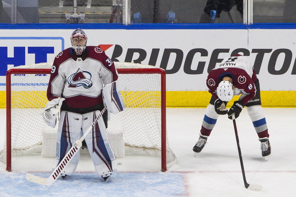 Colorado Avalanche's goalie Pavel Francouz (39) and Cale Makar (8) react to a goal scored by the Dallas Stars during the third period of an NHL hockey second-round playoff series, Sunday, Aug. 30, 2020, in Edmonton, Alberta. (Jason Franson/The Canadian Press via AP)