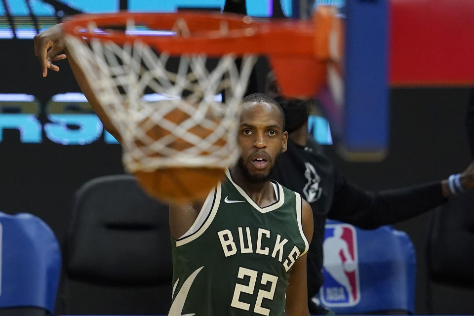 Milwaukee Bucks forward Khris Middleton (22) watches his 3-point basket during the second half of an NBA basketball game against the Golden State Warriors in San Francisco, Tuesday, April 6, 2021. (AP Photo/Jeff Chiu)