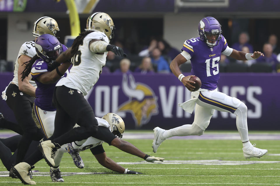 Minnesota Vikings quarterback Joshua Dobbs (15) runs against the New Orleans Saints during the first half of an NFL football game Sunday, Nov. 12, 2023, in Minneapolis. (AP Photo/Matt Krohn)