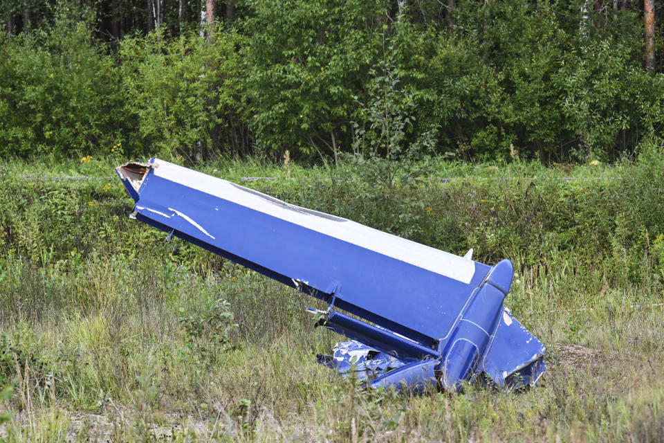 A part of a private jet by the crash site, near the village of Kuzhenkino, Tver region, Russia, Thursday, Aug. 24, 2023. Russian mercenary leader Yevgeny Prigozhin, the founder of the Wagner Group, reportedly died when a private jet he was said to be on crashed on Aug. 23, 2023, killing all 10 people on board. (AP Photo)