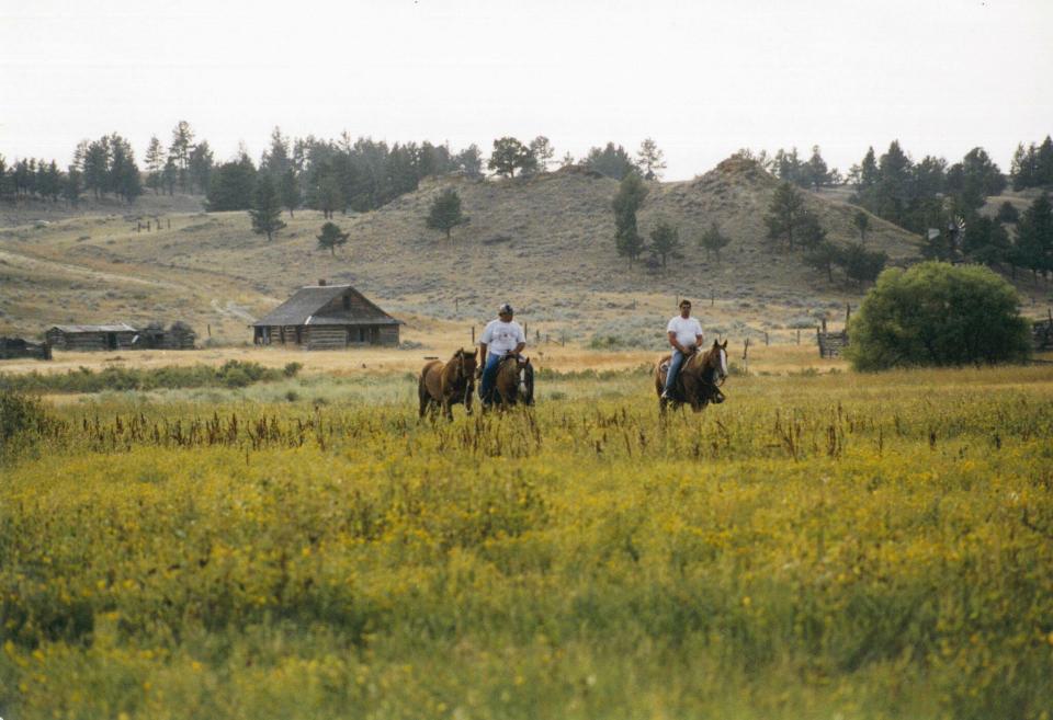 Bert Pezzarossi and husband Dan ride horses in the lush countryside of Montana.