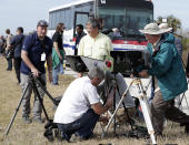 <p>Photographers set up cameras that will fire remotely to record the launch of a Falcon 9 SpaceX heavy rocket at the Kennedy Space Center in Cape Canaveral, Fla., Monday, Feb. 5, 2018. The Falcon Heavy scheduled to launch Tuesday afternoon, has three first-stage boosters, strapped together with 27 engines in all. (Photo: John Raoux/AP) </p>