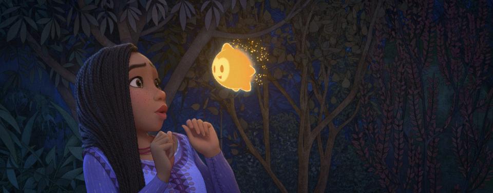 The idealistic Asha (voiced by Ariana DeBose) wishes on a star – which takes form as a rambunctious ball of energy – in the Disney animated musical "Wish."