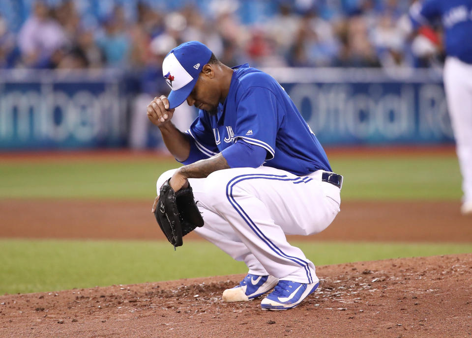 TORONTO, ON - MAY 25: Edwin Jackson #33 of the Toronto Blue Jays reacts after giving up a grand slam home run in the fourth inning during MLB game action to Austin Hedges #18 of the San Diego Padres at Rogers Centre on May 25, 2019 in Toronto, Canada. (Photo by Tom Szczerbowski/Getty Images)