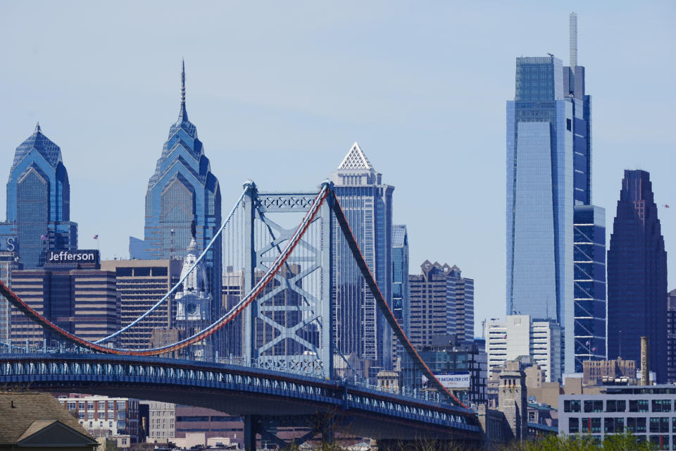 FILE - Shown is the Benjamin Franklin Bridge and the Philadelphia skyline as seen from the Cramer Hill Waterfront Park in Camden, N.J., Wednesday, April 20, 2022. Pennsylvania saw a tenfold increase in deaths of older adults following an abuse or neglect complaint over the past few years, according to state data, and as COVID-19 ravaged the nation, calls for help mushroomed while local agencies struggled to keep caseworkers on staff. (AP Photo/Matt Rourke, File)