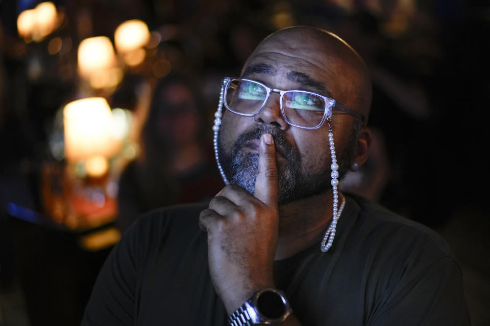 Jocardo Ralston, 47, from Pennsylvania, looks up to a television to watch the presidential debate between President Joe Biden and Republican presidential candidate former President Donald Trump at Tillie's Lounge on Thursday, June 27, 2024, in Cincinnati. "Biden has my vote because there is nothing at this point that Trump can say," said Ralston. For many voters in the U.S., there's despair in the air after the presidential debate this past week. (AP Photo/Carolyn Kaster)