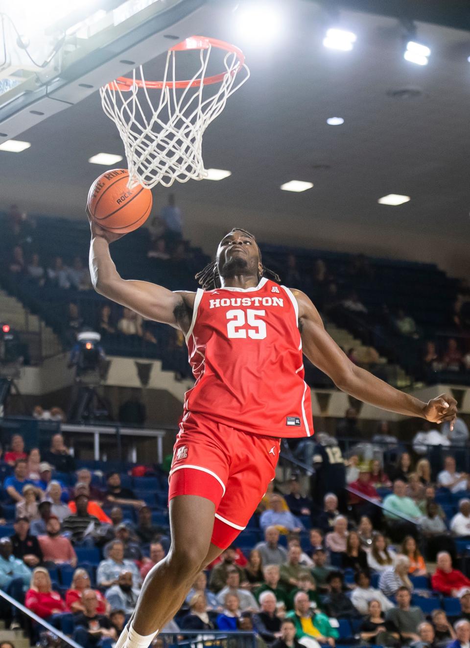 Houston's Jarace Walker (25) throws down a one-handed dunk during the Veterans Classic against St. Joseph's at Navy's Alumni Hall on Friday, Nov. 11, 2022, in Annapolis, Md.