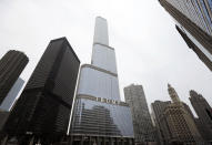 FILE - The Trump International Hotel and Tower, is shown on Thursday, March 10, 2016, in Chicago. Within days, Donald Trump could potentially have his sprawling real estate business empire ordered “dissolved” for repeated misrepresentations on financial statements to lenders, adding him to a short list of scam marketers, con artists and others who have been hit with the ultimate punishment for violating New York’s powerful anti-fraud law. An Associated Press analysis of nearly 70 years of civil cases under the law showed that such a penalty has only been imposed a dozen previous times. (AP Photo/Charles Rex Arbogast, File)