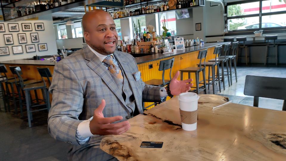 Businessman Ugo Nwagbaraocha speaks about how Milwaukee County can better support Black businesses during County Executive David Crowley's Coffee with Crowley event series. Nwagbaraocha, president of the Wisconsin chapter of the National Association of Minority Contractors, wants the county to make the procurement process more malleable by breaking up larger contracts into small, digestible ones.