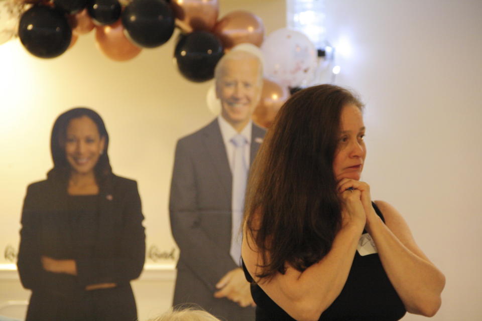 Democratic candidates Rep. Don Davis and state Rep. Terence Everitt listen to speakers at the Granville County Democratic Party fundraiser in Oxford, N.C., while standing among other attendees on Friday, May 10, 2024. The candidates told guests that Granville County could have serious implications on the outcome of the 2024 election. (AP Photo/Makiya Seminera)