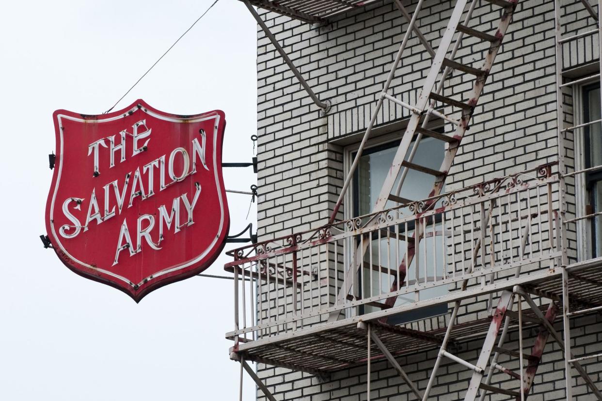 salvation army sign next to fire escape
