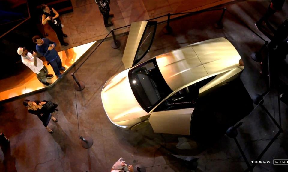 <span>Tesla's robotaxi displayed at an unveiling event in Los Angeles, California.</span><span>Photograph: Tesla/Reuters</span>