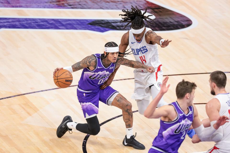 Utah Jazz guard Jordan Clarkson (00) drives against LA Clippers guard Terance Mann (14) at the Delta Center in Salt Lake City on Friday, Dec. 8, 2023. | Spenser Heaps, Deseret News