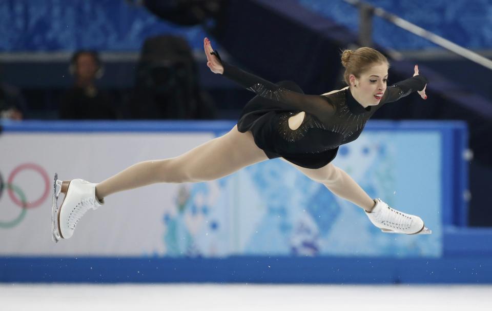 Italy's Carolina Kostner competes during the figure skating women's free skating program at the 2014 Sochi Winter Olympics, February 20, 2014. REUTERS/Lucy Nicholson (RUSSIA - Tags: OLYMPICS SPORT FIGURE SKATING)