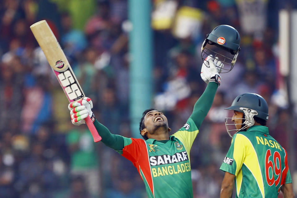 Bangladesh's Mushfiqur Rahim, left, celebrates after scoring a century, as Nasir Hossain smiles during the Asia Cup one-day international cricket tournament against India in Fatullah, near Dhaka, Bangladesh, Wednesday, Feb. 26, 2014. (AP Photo/A.M. Ahad)