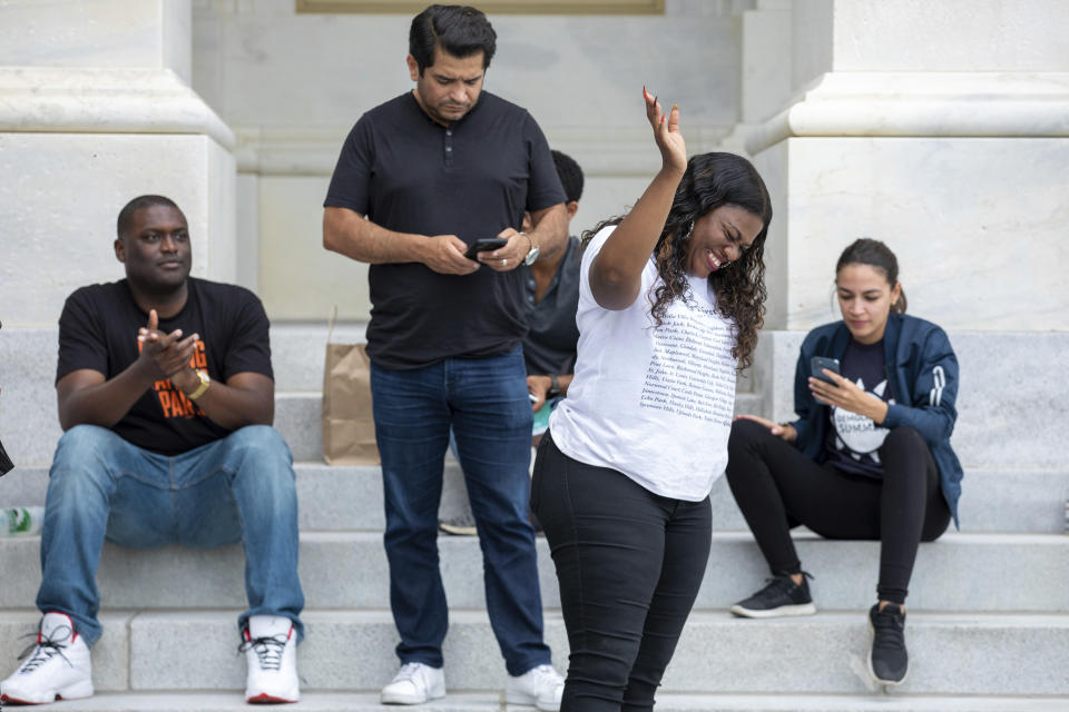 From left, Rep. Mondaire Jones, D-N.Y., Rep. Alexandria Ocasio-Cortez, D-N.Y., Rep. Cori Bush, D-Mo., and Rep. Jimmy Gomez, D-Calif., celebrate the announcement that the Biden administration will enact a targeted nationwide eviction moratorium outside of Capitol Hill in Washington on Tuesday, Aug. 3, 2021. (AP Photo/Amanda Andrade-Rhoades)