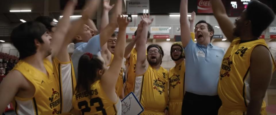 a basketball team cheers