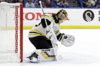 Boston Bruins goaltender Tuukka Rask (40) makes a glove save on a shot by the Tampa Bay Lightning during the second period of an NHL hockey game Tuesday, March 3, 2020, in Tampa, Fla. (AP Photo/Chris O'Meara)