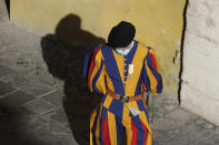 FILE - In this Sept. 2, 2020 file photo, a Vatican Swiss Guard wears a face mask to prevent the spread of COVID-19 in the San Damaso courtyard ahead of Pope Francis' general audience, the first with faithful since February when the coronavirus outbreak broke out, at the Vatican. On Monday, Oct. 12, 2020, the Vatican said in a statement that four Swiss Guards have tested positive for the coronavirus, as the surge in infections in surrounding Italy enters the Vatican walls. (AP Photo/Andrew Medichini, file)
