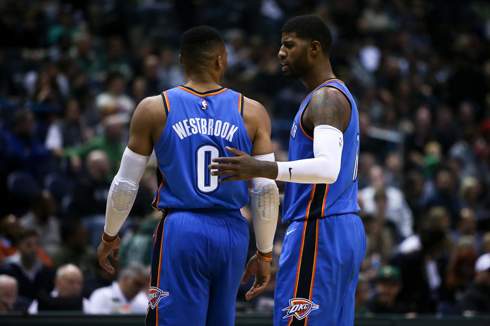 MILWAUKEE, WI - OCTOBER 31:  Russell Westbrook #0 and Paul George #13 of the Oklahoma City Thunder meet in the third quarter against the Milwaukee Bucks at the Bradley Center on October 31, 2017 in Milwaukee, Wisconsin. NOTE TO USER: User expressly acknowledges and agrees that, by downloading and or using this photograph, User is consenting to the terms and conditions of the Getty Images License Agreement. (Photo by Dylan Buell/Getty Images)