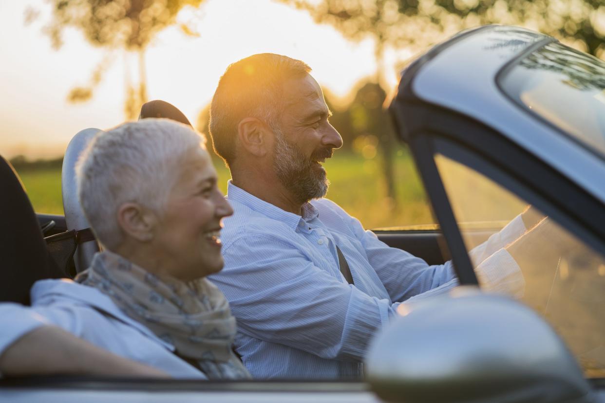 senior couple in convertible car