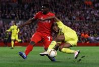 Britain Football Soccer - Liverpool v Villarreal - UEFA Europa League Semi Final Second Leg - Anfield, Liverpool, England - 5/5/16 Liverpool's Kolo Toure in action with Villarreal's Cedric Bakambu Reuters / Phil Noble Livepic