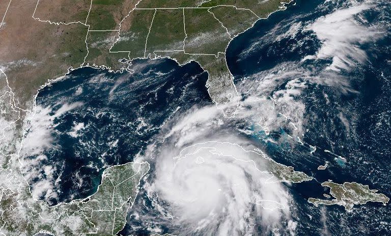 In this NOAA handout image, Hurricane Ian moves toward western Cuba on Sept. 26, 2022, in the Caribbean Sea. The storm is expected to bring a potentially life-threatening storm surge and hurricane-force winds. Meteorologists expect Ian to peak at Category 4 strength over the Gulf of Mexico later this week, then weaken before reaching Fla.