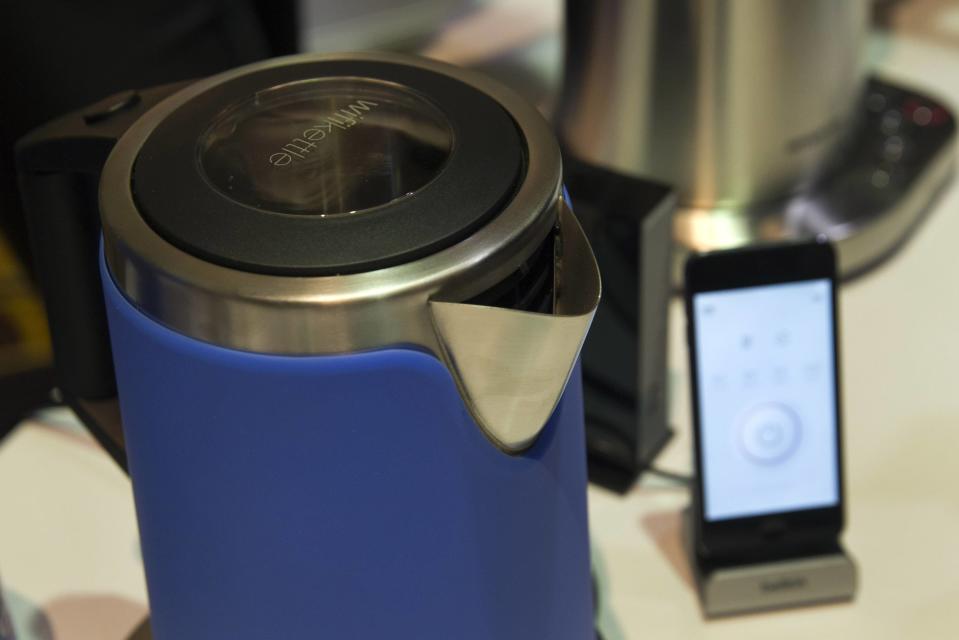 Internet-enable kettles and coffee makers by Smarter are displayed during the 2015 International Consumer Electronics Show (CES) in Las Vegas, Nevada January 4, 2015. The kettle and coffee maker can be controlled by a smart phone. The coffee maker will also alert the owner if it is running low on coffee or lacking water in the device. REUTERS/Steve Marcus
