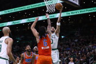 Boston Celtics' Jayson Tatum goes to the basket against Oklahoma City Thunder's Jaylin Williams during the first half of an NBA basketball game Wednesday, April 3, 2024, in Boston. (AP Photo/Winslow Townson)